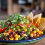 A vibrant and healthy Mexican dish showcasing colorful vegetables, beans, and fresh herbs.